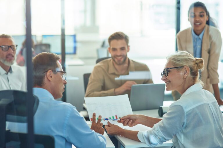 Executives reviewing a report together at a conference table